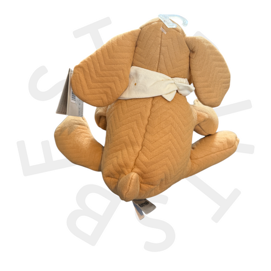 Back of Nattou soft toy dog with tag and scarf